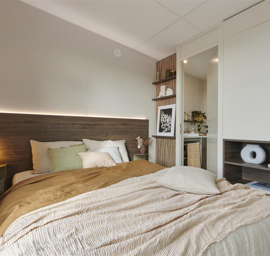 Ouderslaapkamer in stacaravan met 4 bloemen - Camping pomme de pin